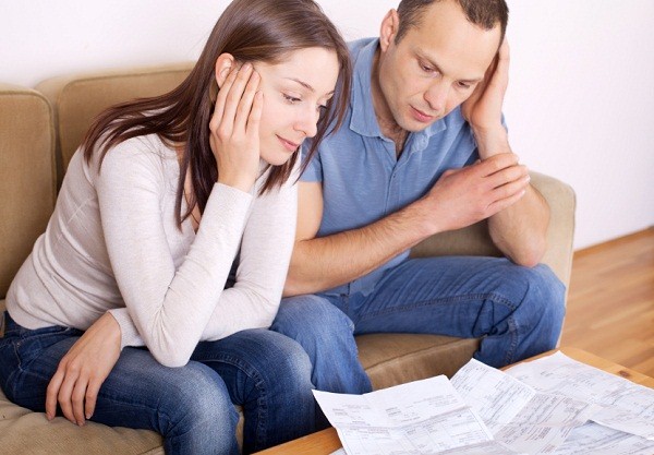 couple reviewing unpaid bills