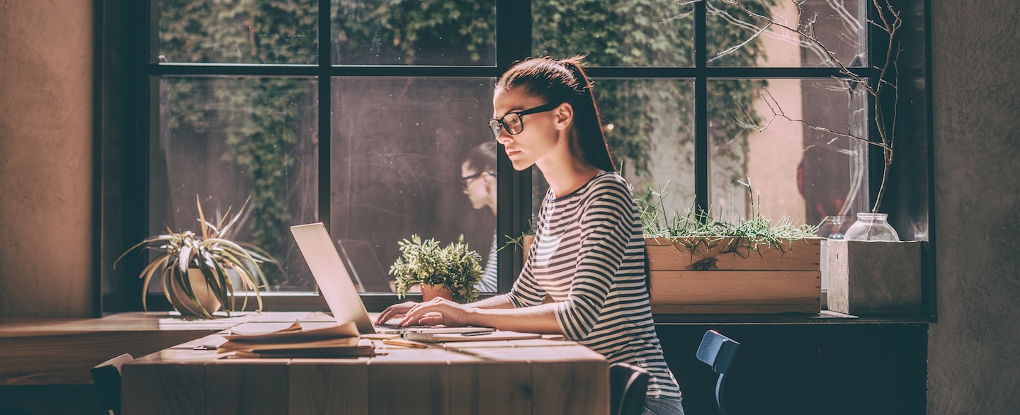 Professional Woman Typing on Laptop