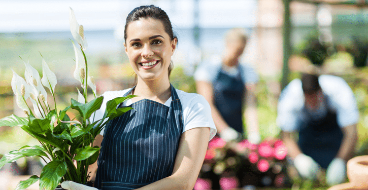 Female Customer with a Potted Plant in a Florist's Store