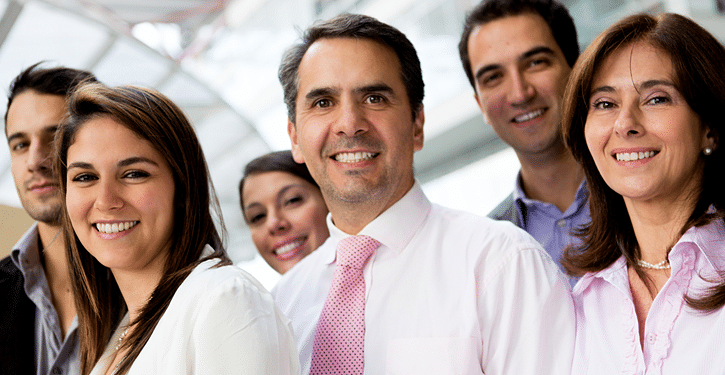 Cheerful Group of Professionals Posed for Photograph, Radiating Positivity and Camaraderie