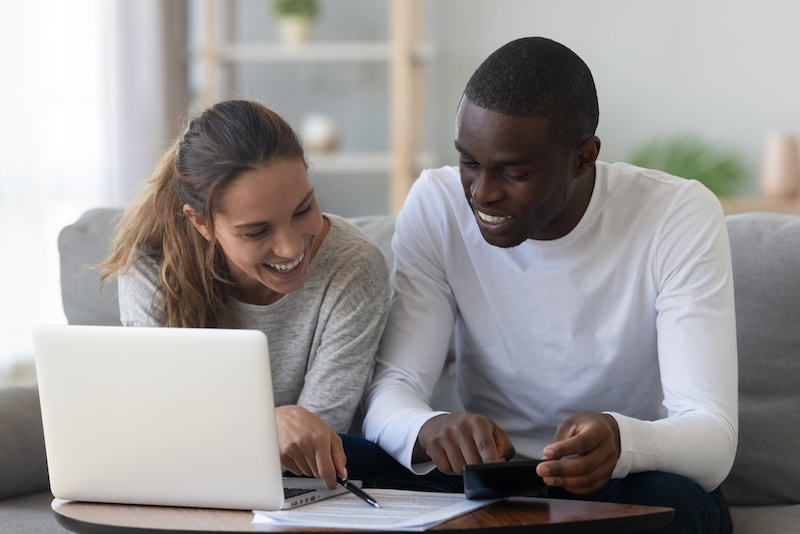 couple looking at credit report documents