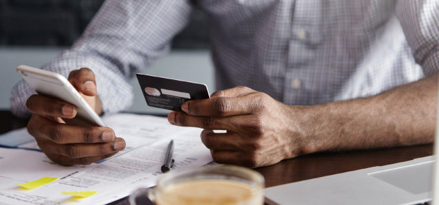 man doing personal accounting on phone