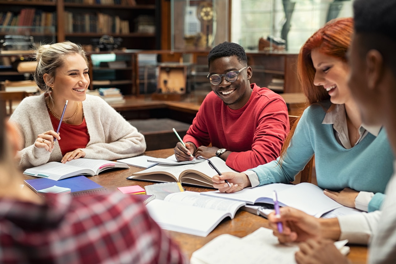 Students studying in a library build credit by learning and gaining knowledge