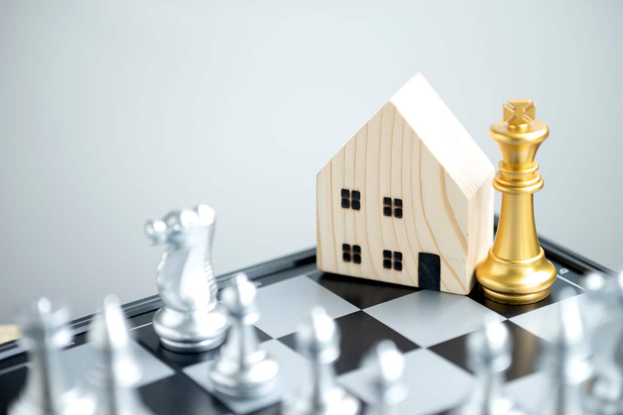 Strategic Decisions in the Game of Life: Golden Chess Pieces and a House on a Chess Board