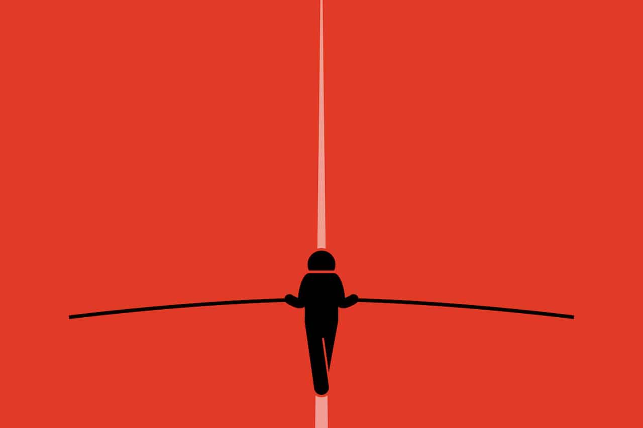 Daring Balancing Act: Man on Tightrope Against Vibrant Red Backdrop