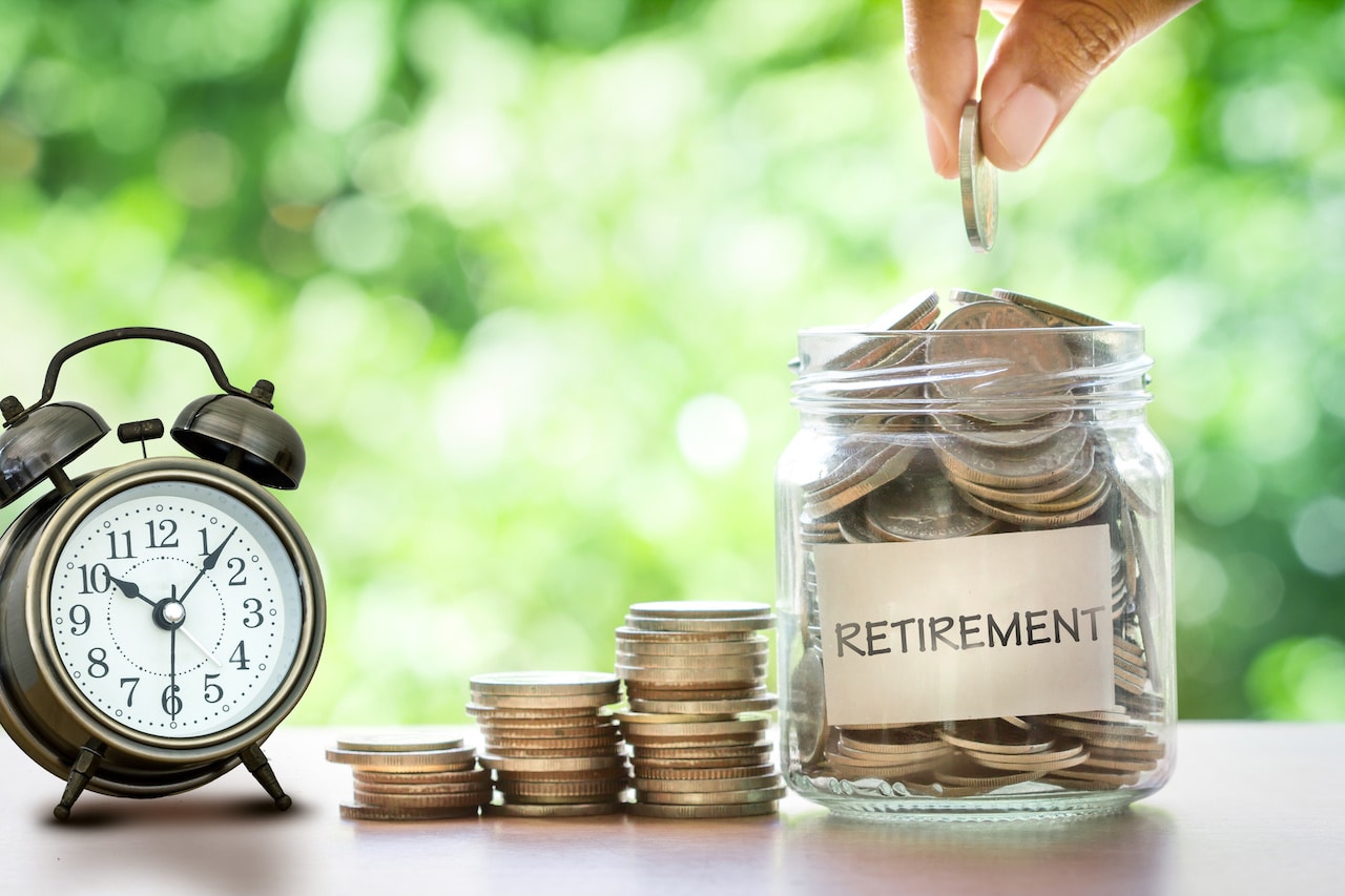 Visual Reminder: Save for Your Future with Retirement Savings Jar, Coins, and Alarm Clock