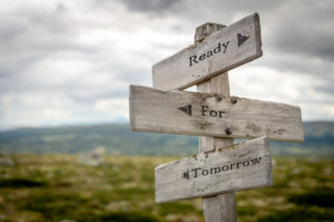 Wooden Signpost with Three Directional Arrows Guiding Travelers