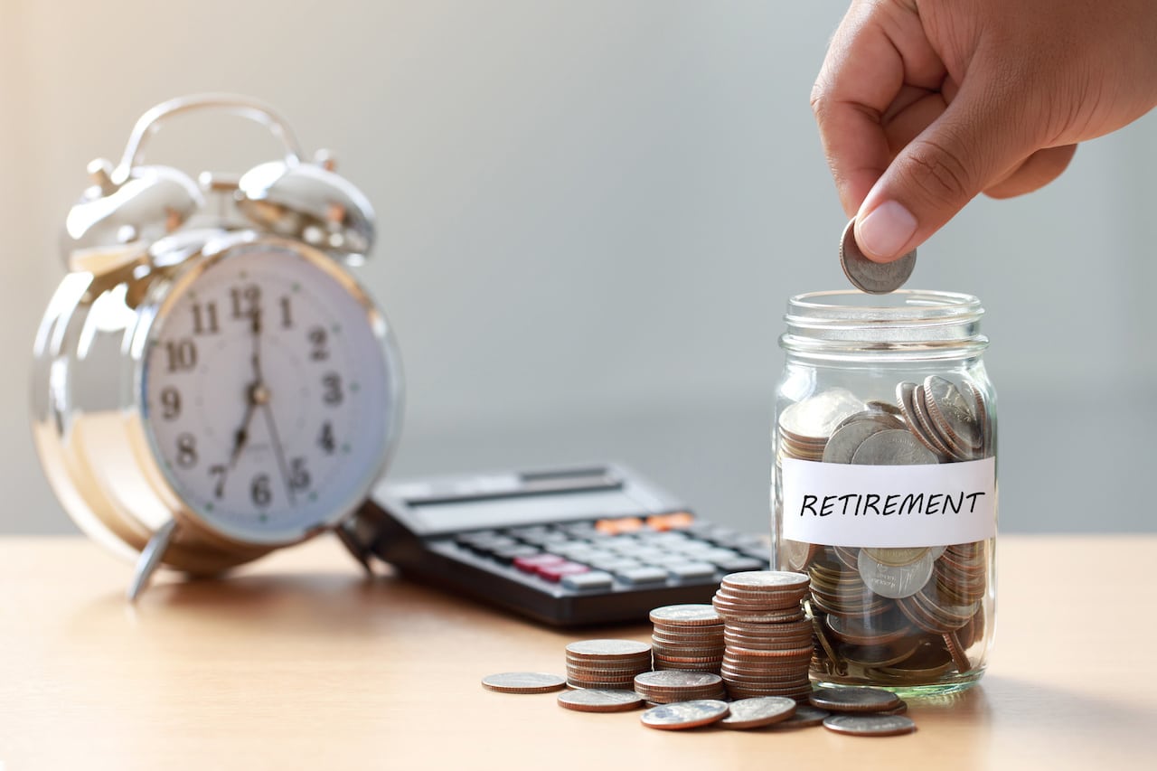 Retirement Savings Jar with Coins and Alarm Clock - Visual Reminder to Save for the Future