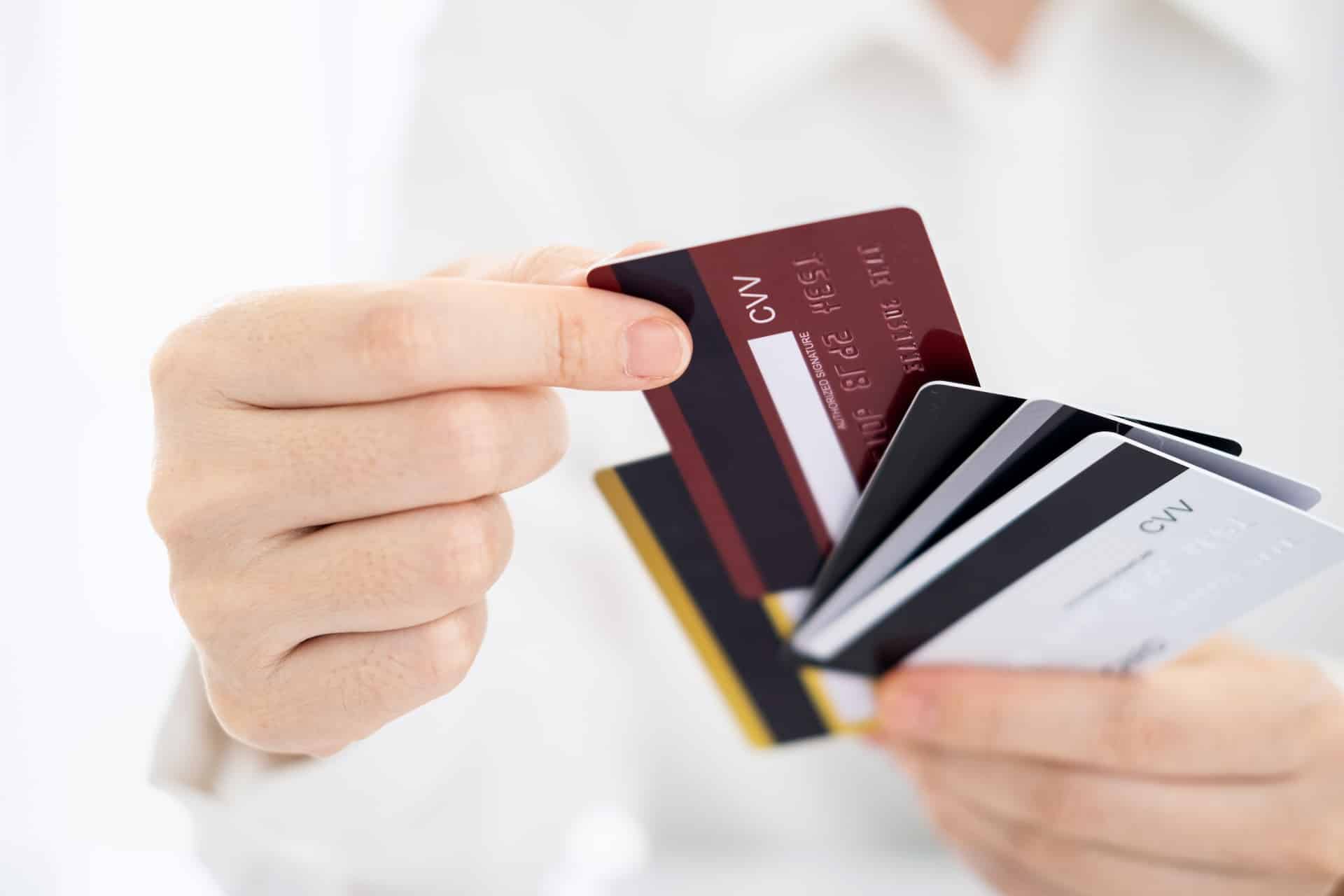 Woman Holding Multiple Credit Cards - Credit Dependency Concept