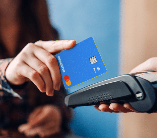 Young Woman Paying With Credit Card